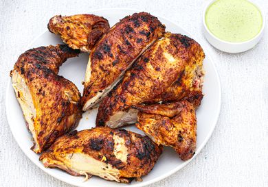 Peruvian-style grilled chicken with green sauce.
