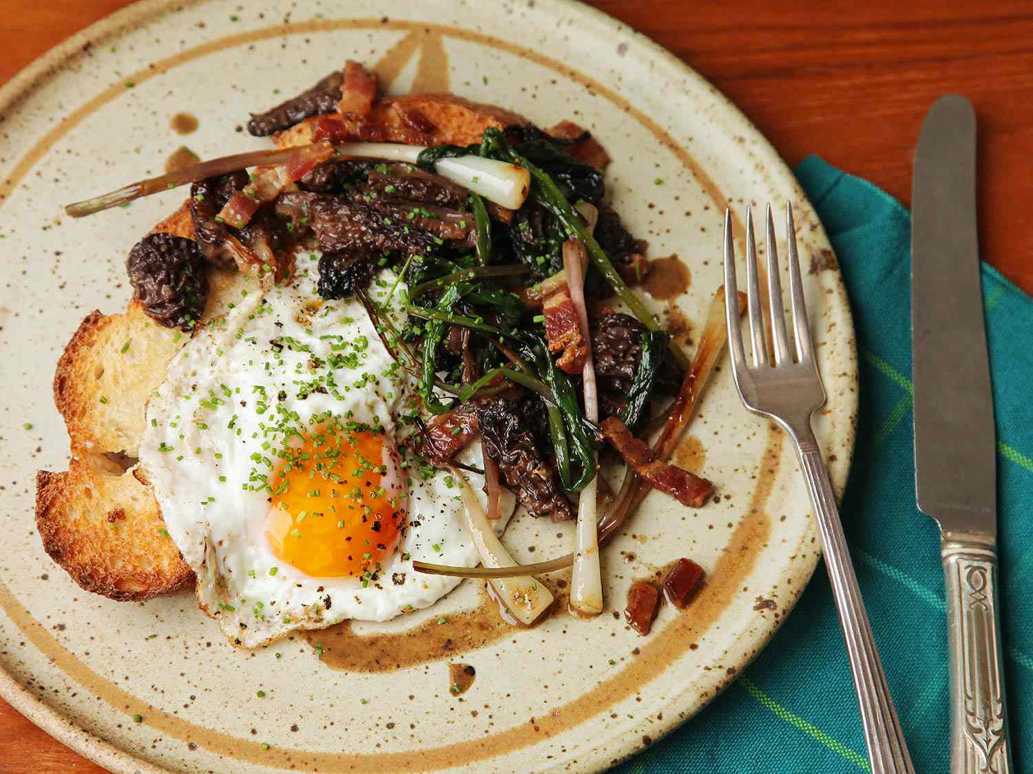 Eggs, ramps, and morels on crispy toast.