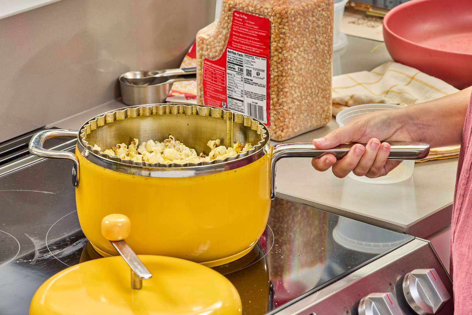 A person holds the Popsmith The Popper by the handle