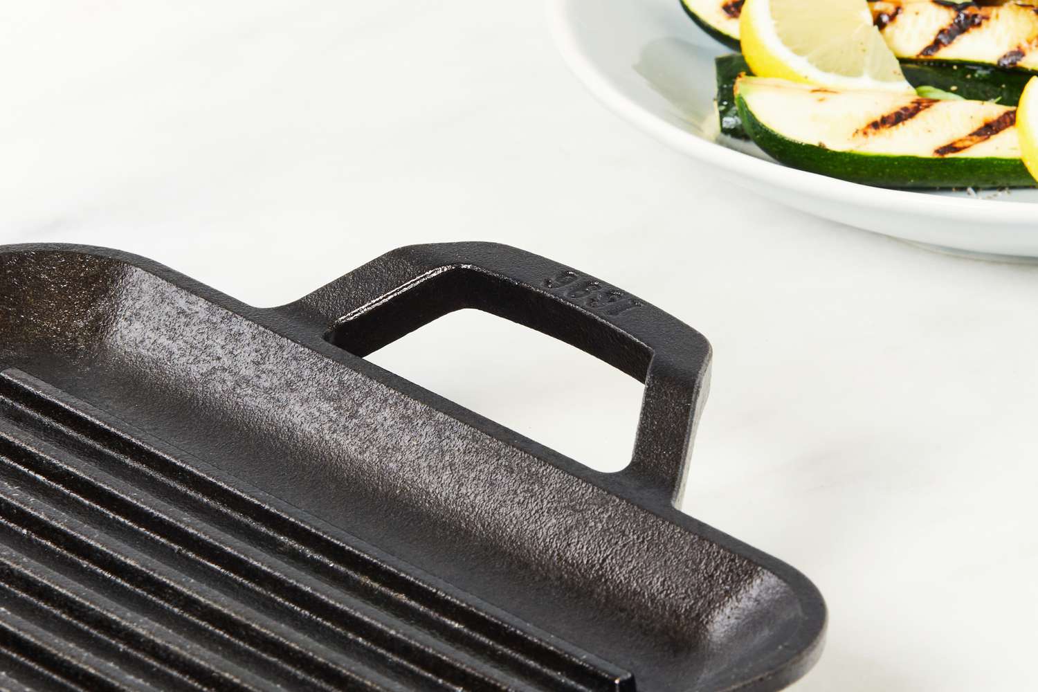 Close-up of the Lodge 11-Inch Cast Iron Square Grill Pan's handle