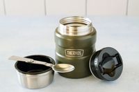 the stanley food thermos with the lid off and in the spoon resting on the cup