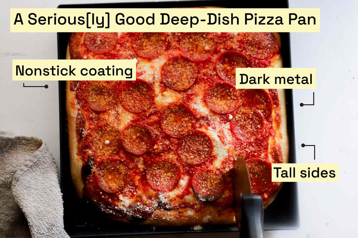 A Sicilian style pizza in a black pan