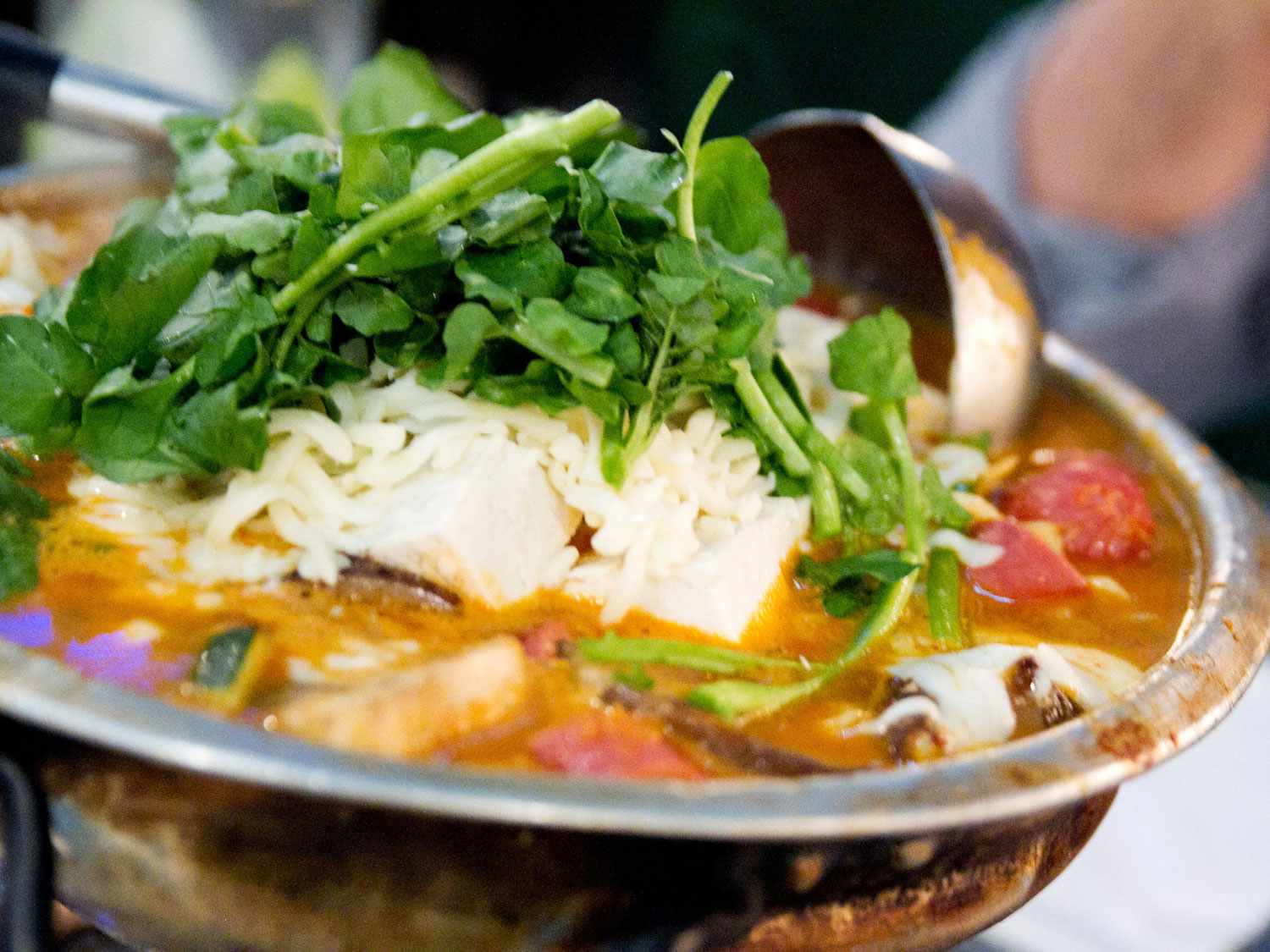 a metal pot full of budae jjigae