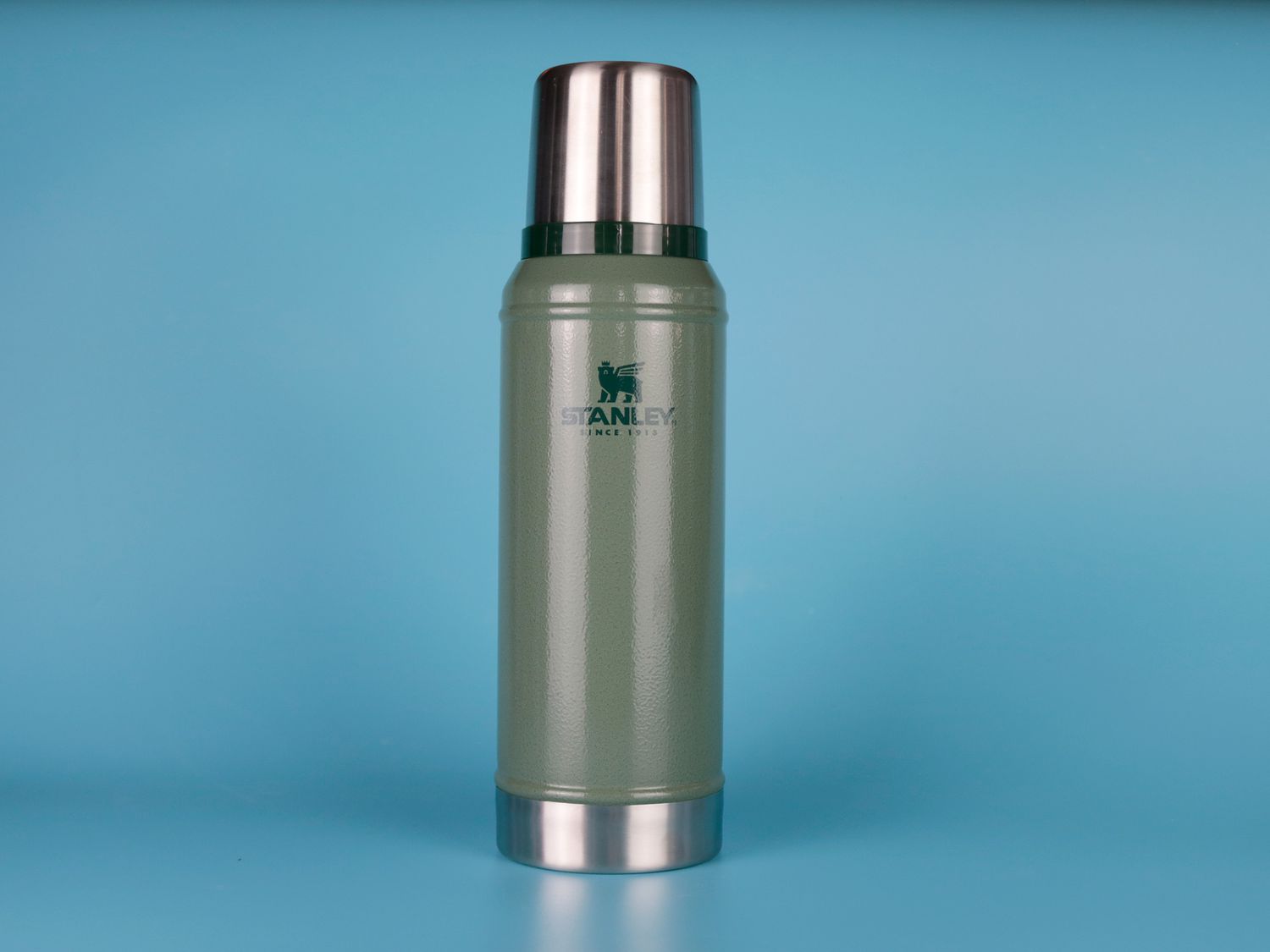 Stanley Classic Vacuum Insulated Bottle against blue backdrop