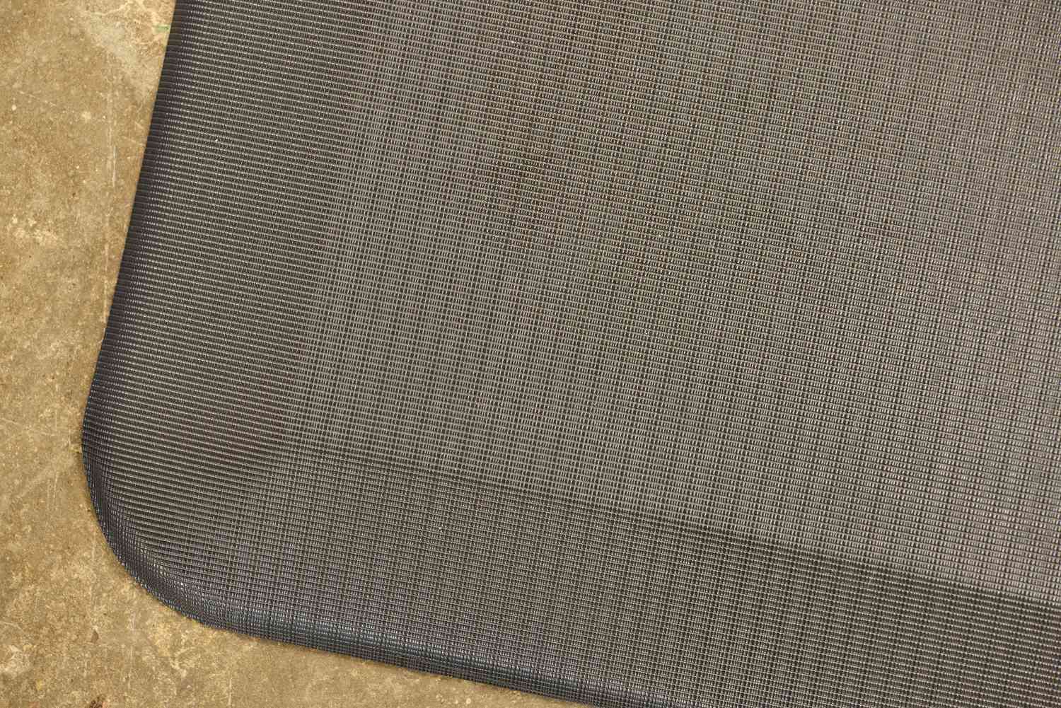 A close-up of the corner on the ComfiLife Anti-Fatigue Floor Mat