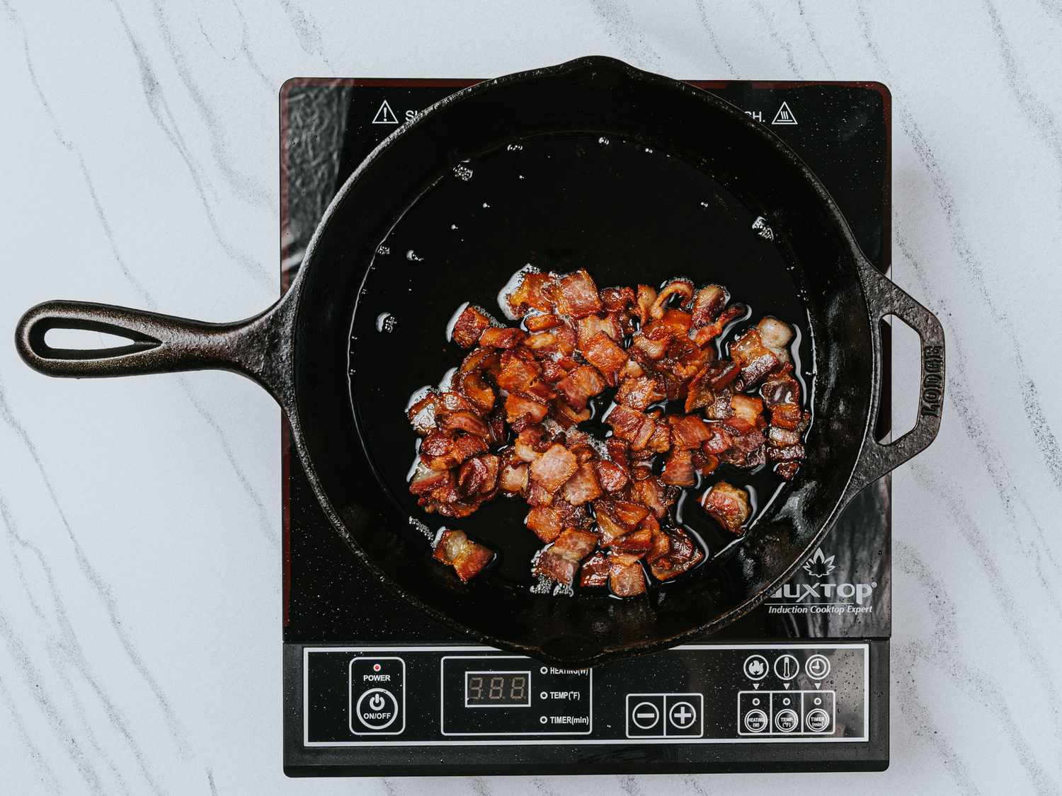 Overhead view of bacon in skillet