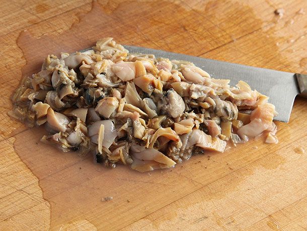 Whole cooked clams have been chopped into smaller pieces. 