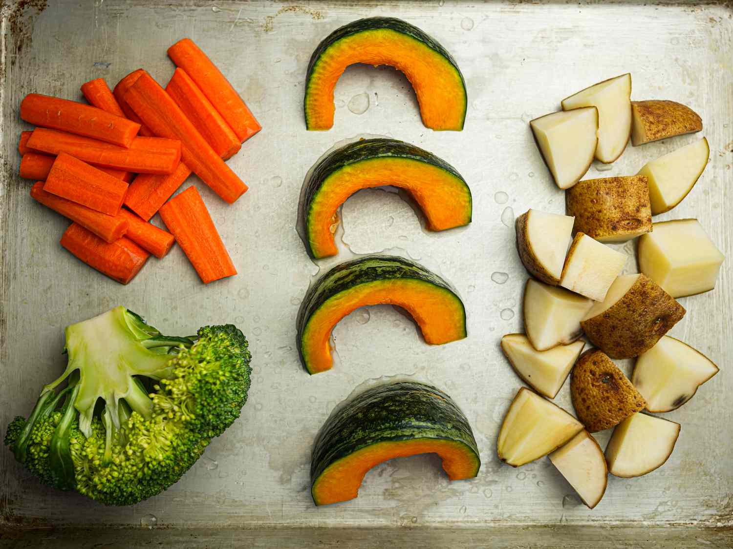 Overhead view of vegetables on a sheet tray