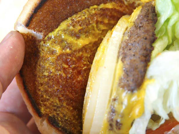 An In-N-Out burger with mustard and ketchup