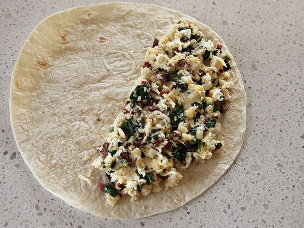 The ramp quesadilla mixture spread over half of an open tortilla.