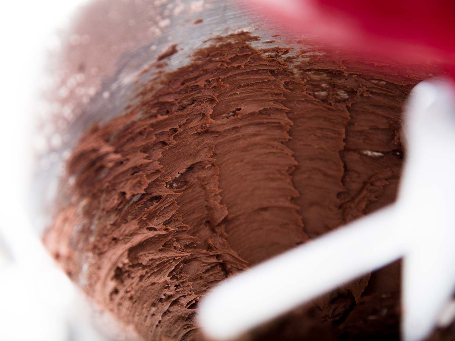 Beating the butter with powdered sugar and cocoa until smooth.