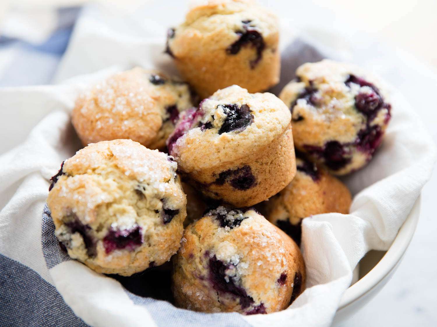 A bowl of just-baked blueberry muffins.