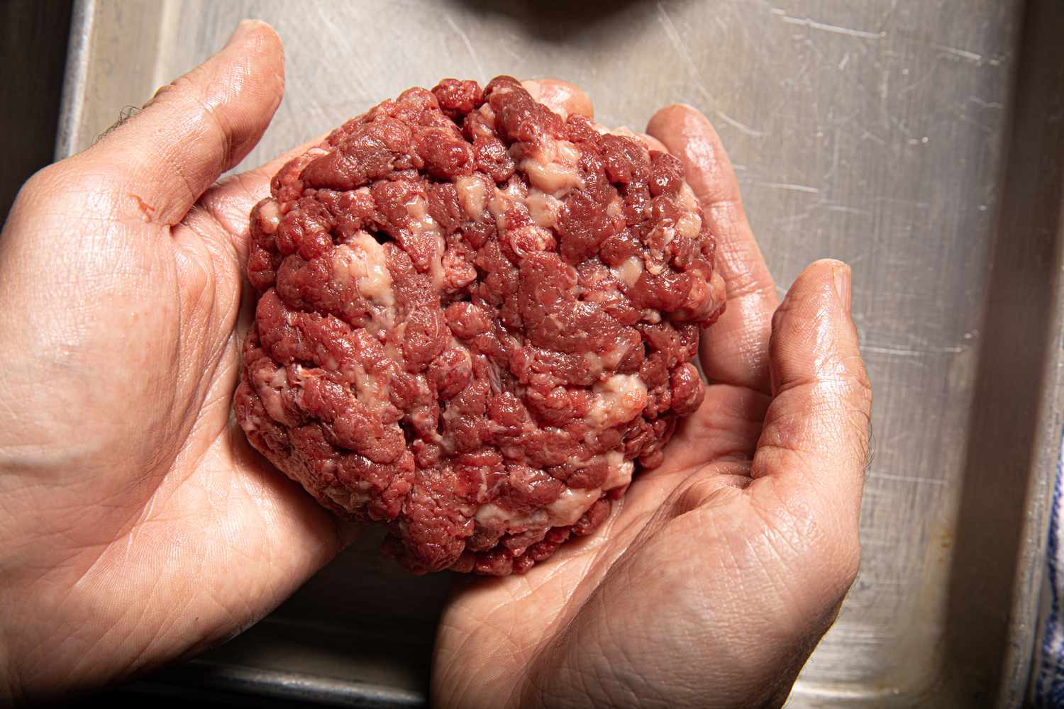 Forming a waygu burger in hands