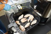 Raw chicken wings in the Instant Pot Vortex Plus 6-Quart 6-in-1 Air Fryer's basket