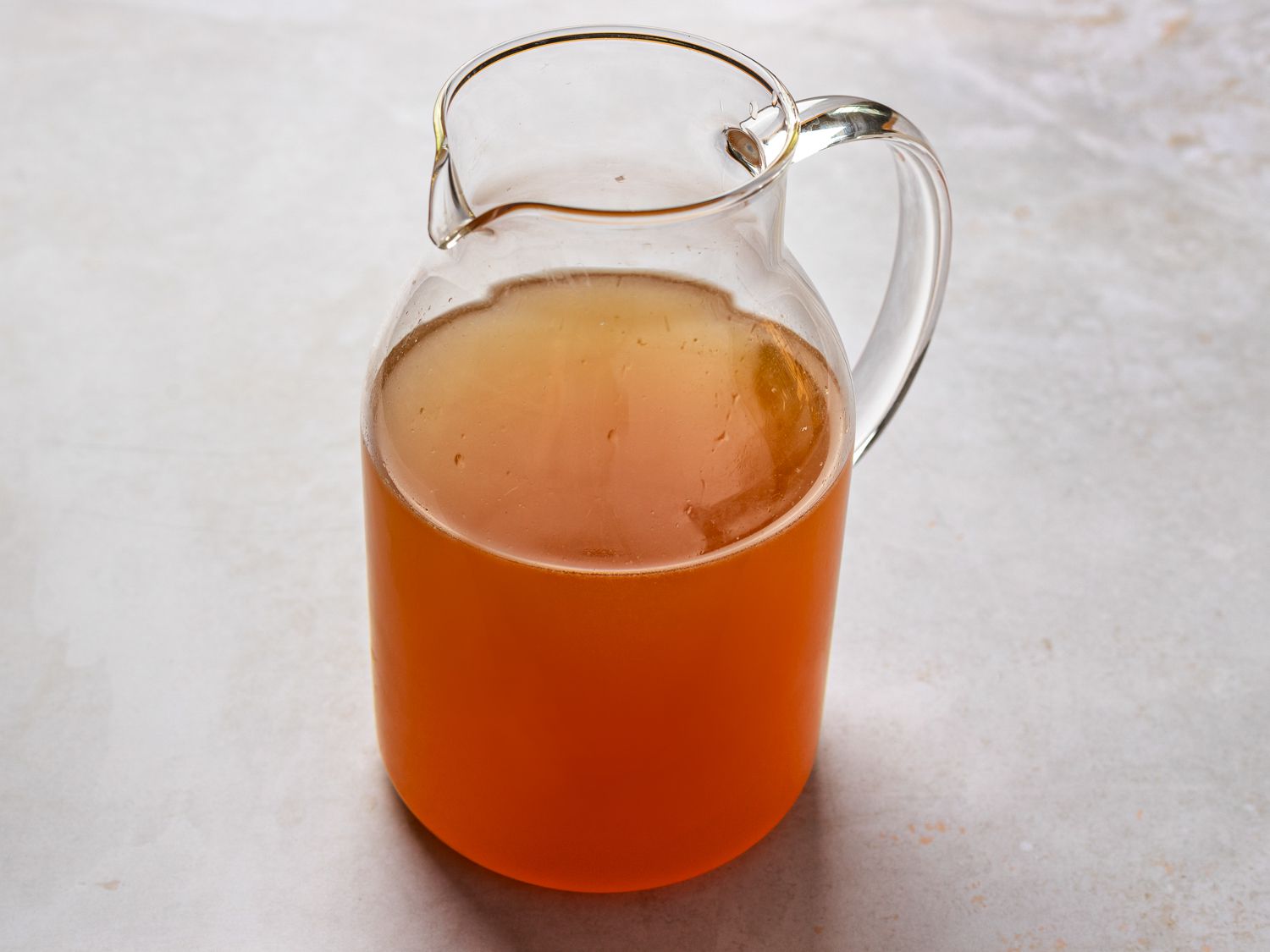 A glass pitcher holding concentrated Arnold Palmer.