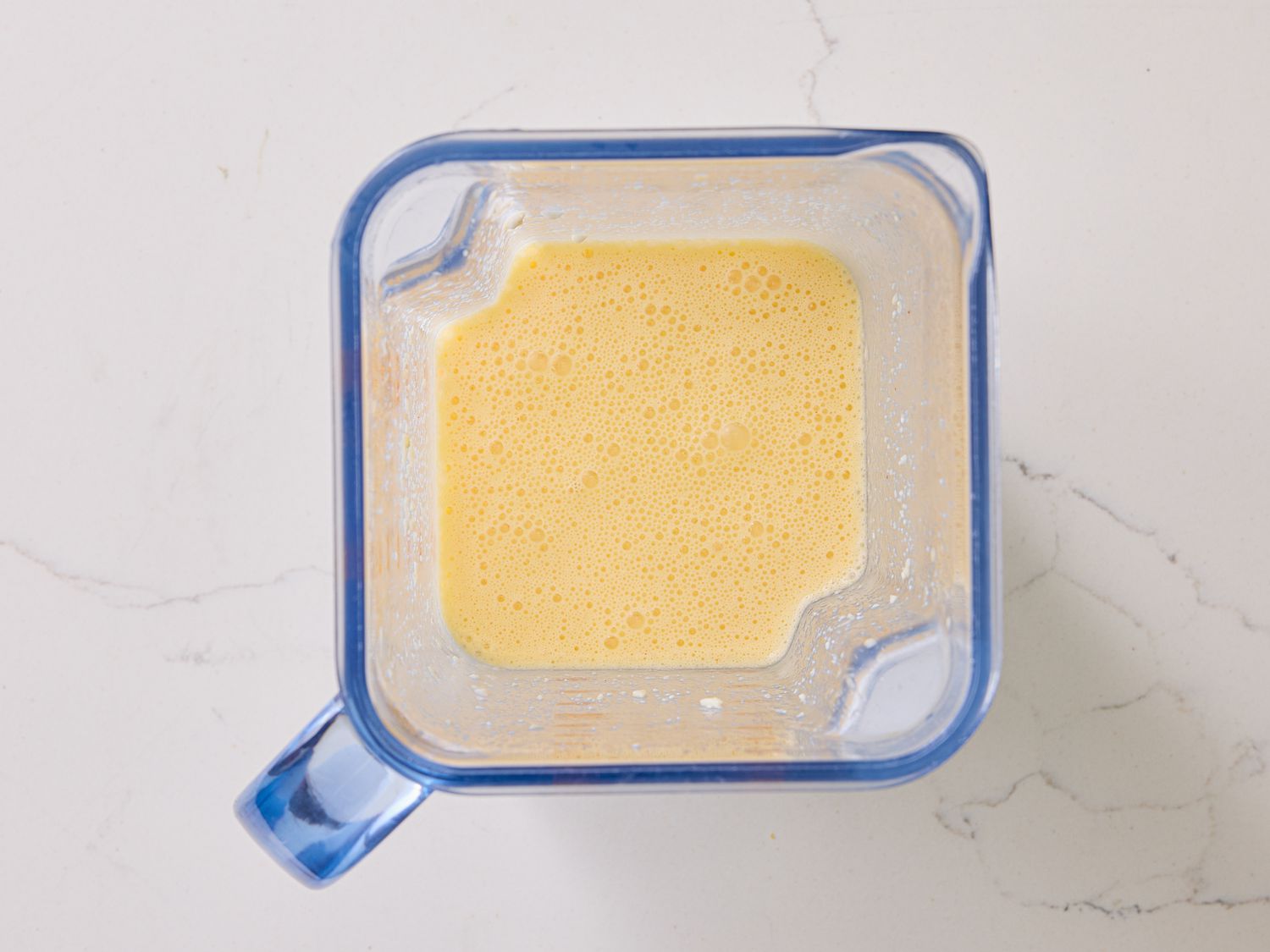 Blender with eggs blended into it 