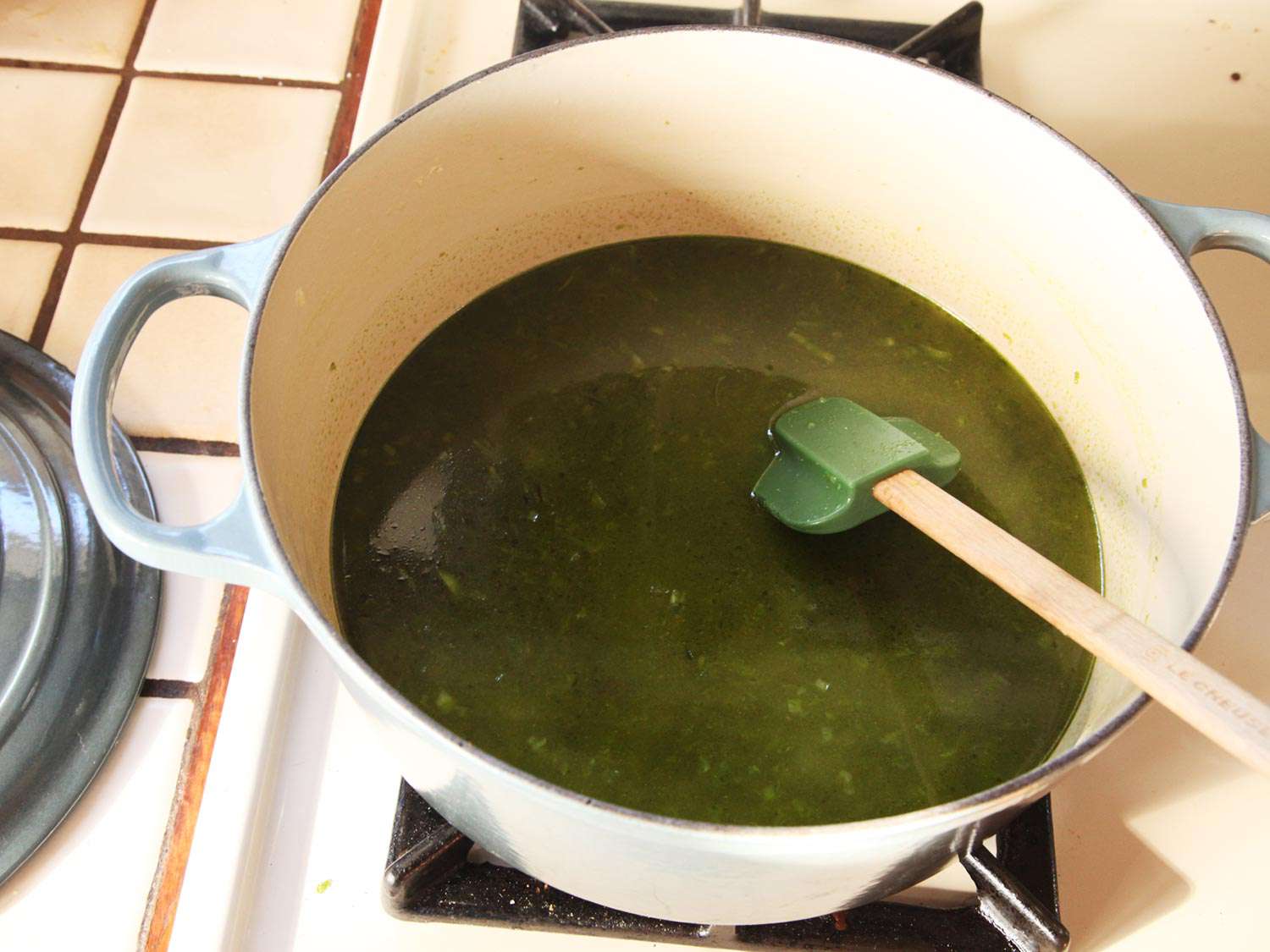 Sautéed chiles simmering in stock.