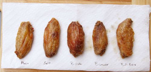 Comparison of baked buffalo wings tossed in salt, baking soda, baking powder, and soda-water solution