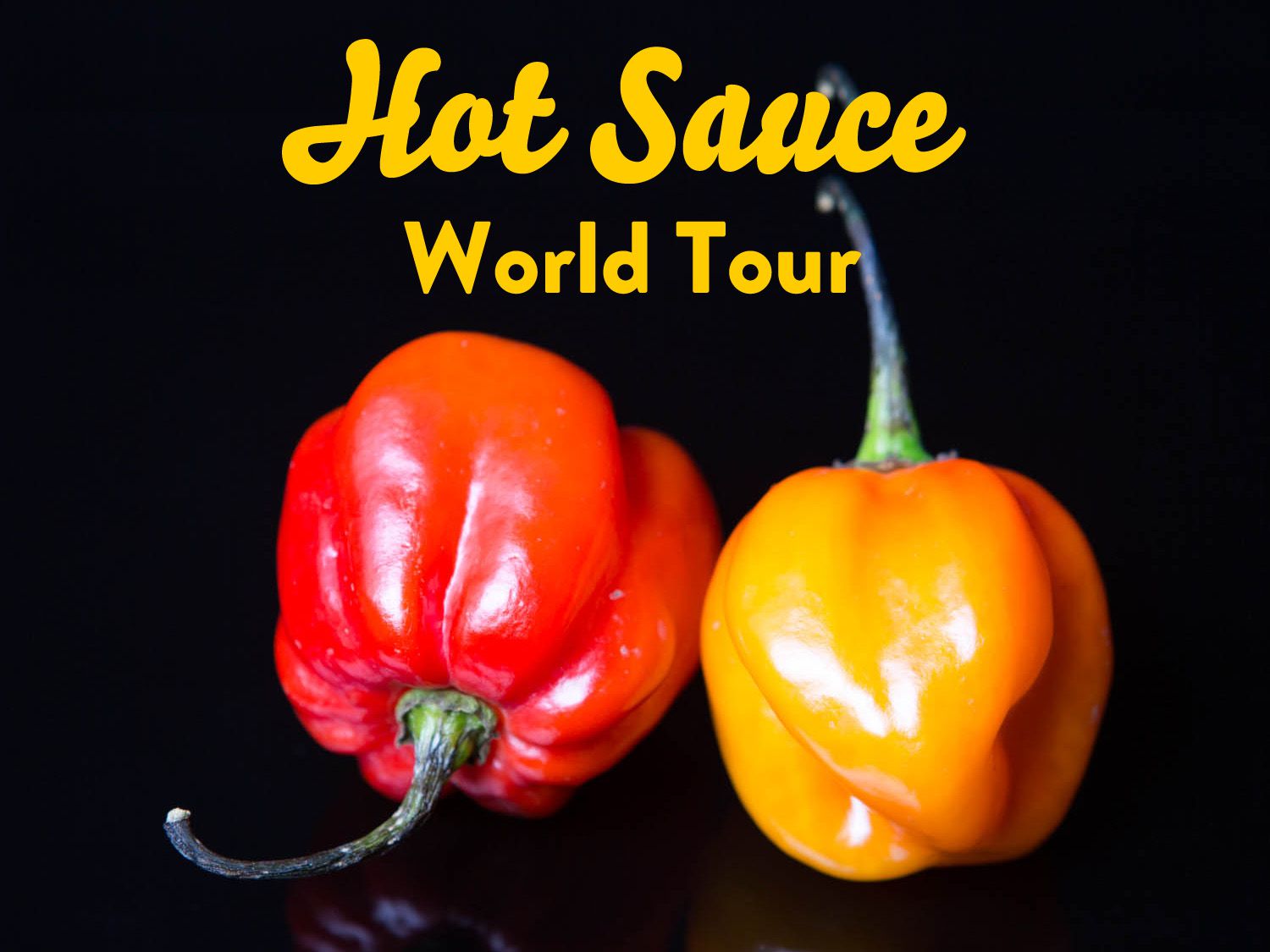 Two scotch bonnet peppers side by side with the words "Hot Sauce World Tour" superimposed over the top of the image.