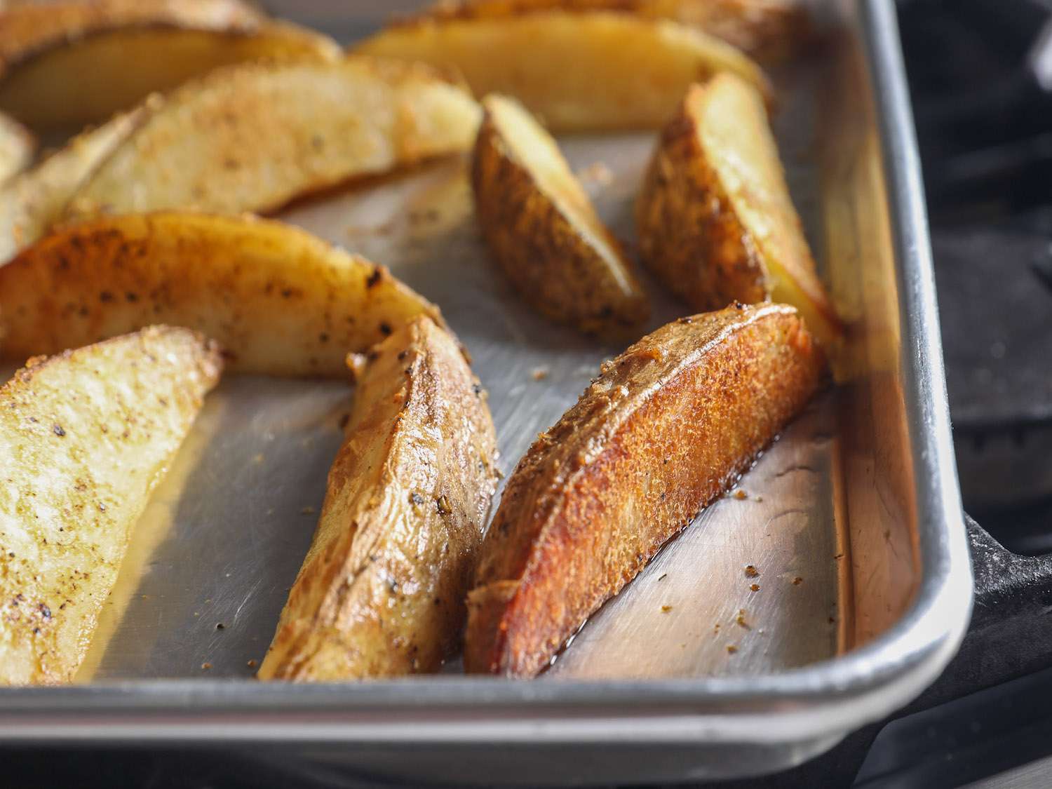 Turning wedges onto second cut side halfway through roasting.