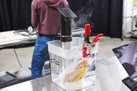 Anova Culinary Precision Cooker Pro inside container with water and food