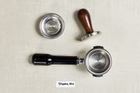 Parts of the portafilter Diletta Mio Espresso Machine on a table