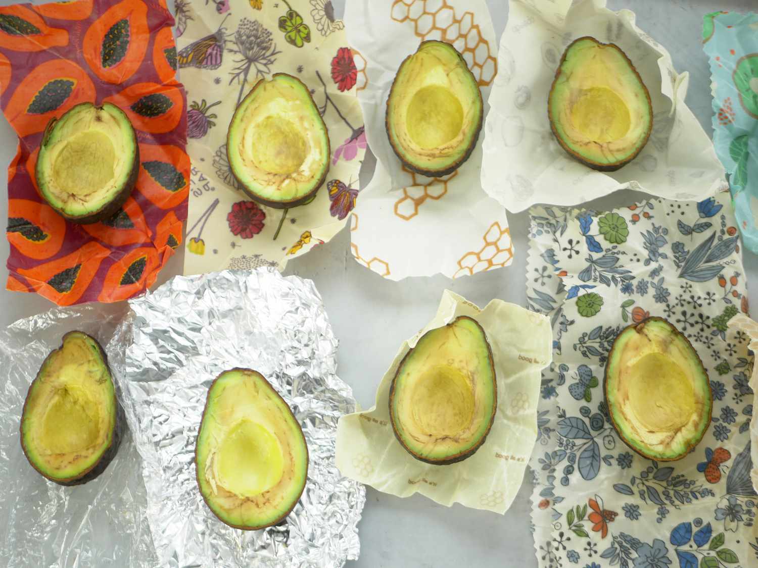 a variety of avocados on top of the wraps they were stored in