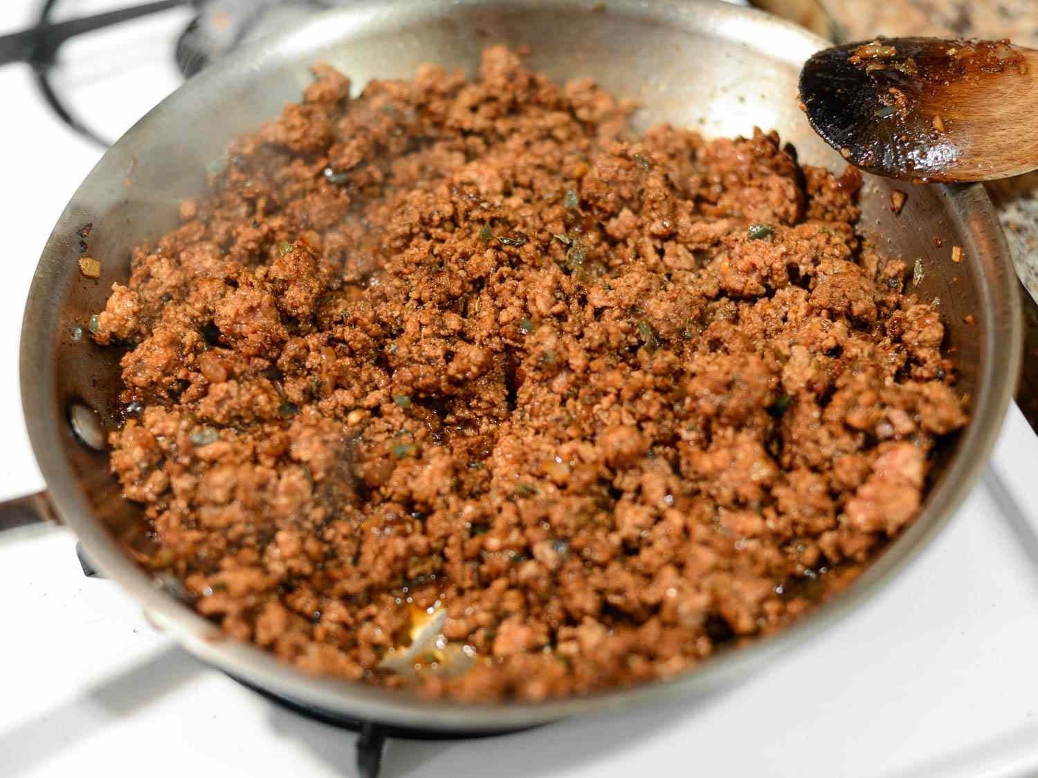A pan of spicy beef taco filling for San Antonio-style puffy tacos.