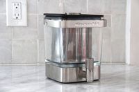 The KitchenAid cold brew maker on a marble kitchen coutnertop.