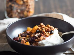 A bowl of light and crisp homemade granola served with yogurt. 