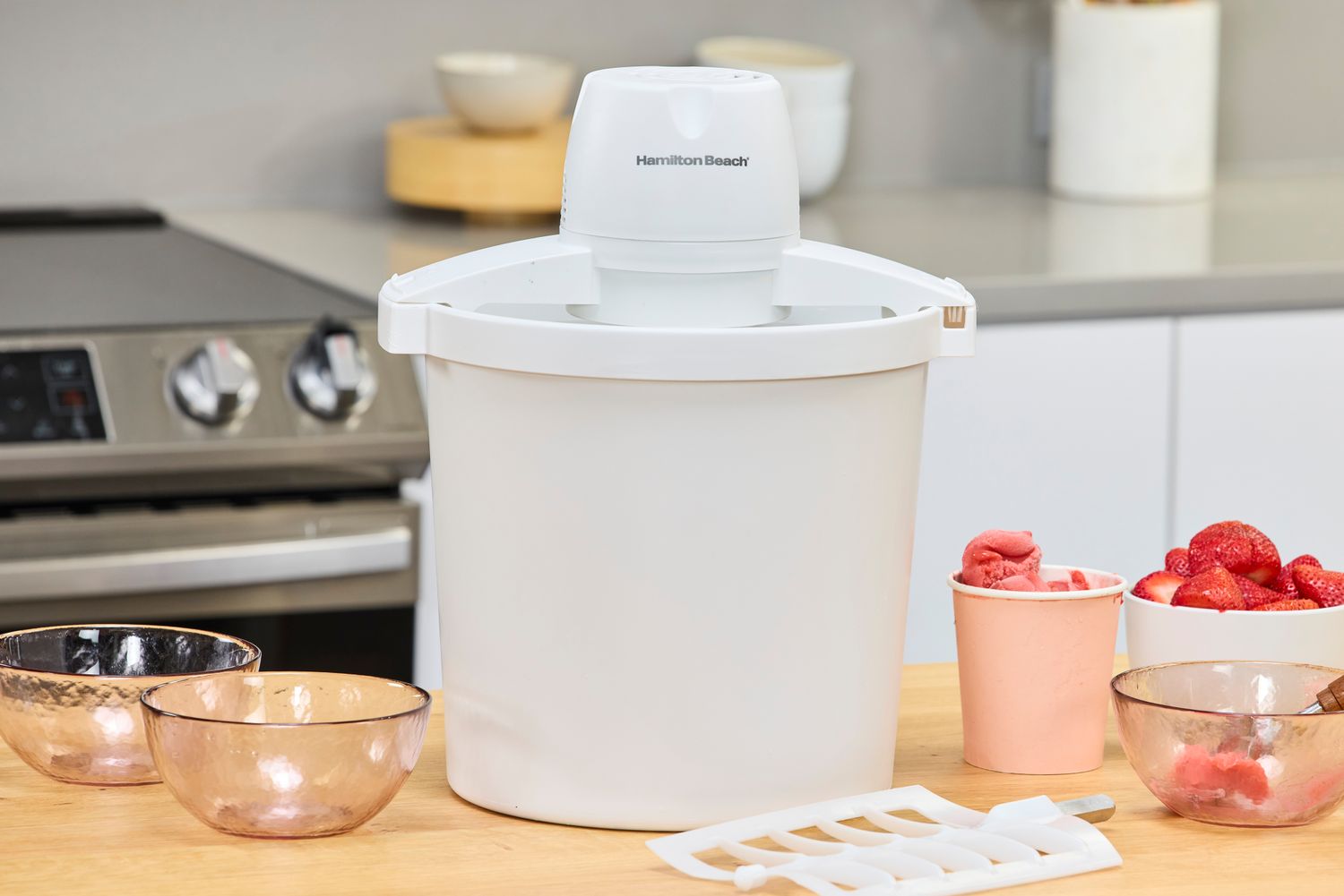 The Hamilton Beach Automatic Ice Cream Maker on a wooden surface