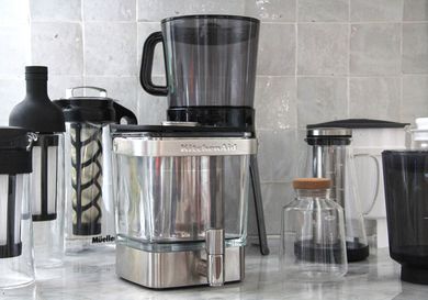 Numerous cold brew maker son a kitchen countertop.