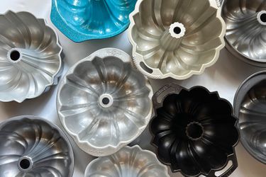 A group of Bundt pans on a white surface