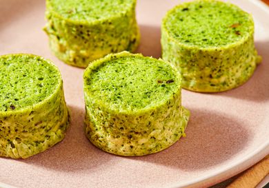 Four kale and mushroom egg bites on a plate