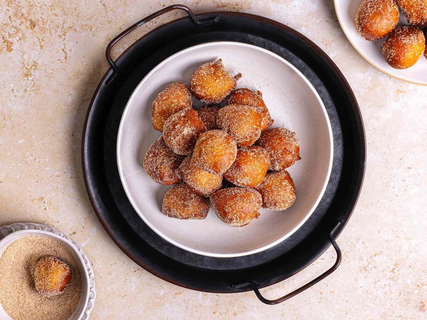 Puff puff tossed with sugar on a plate 