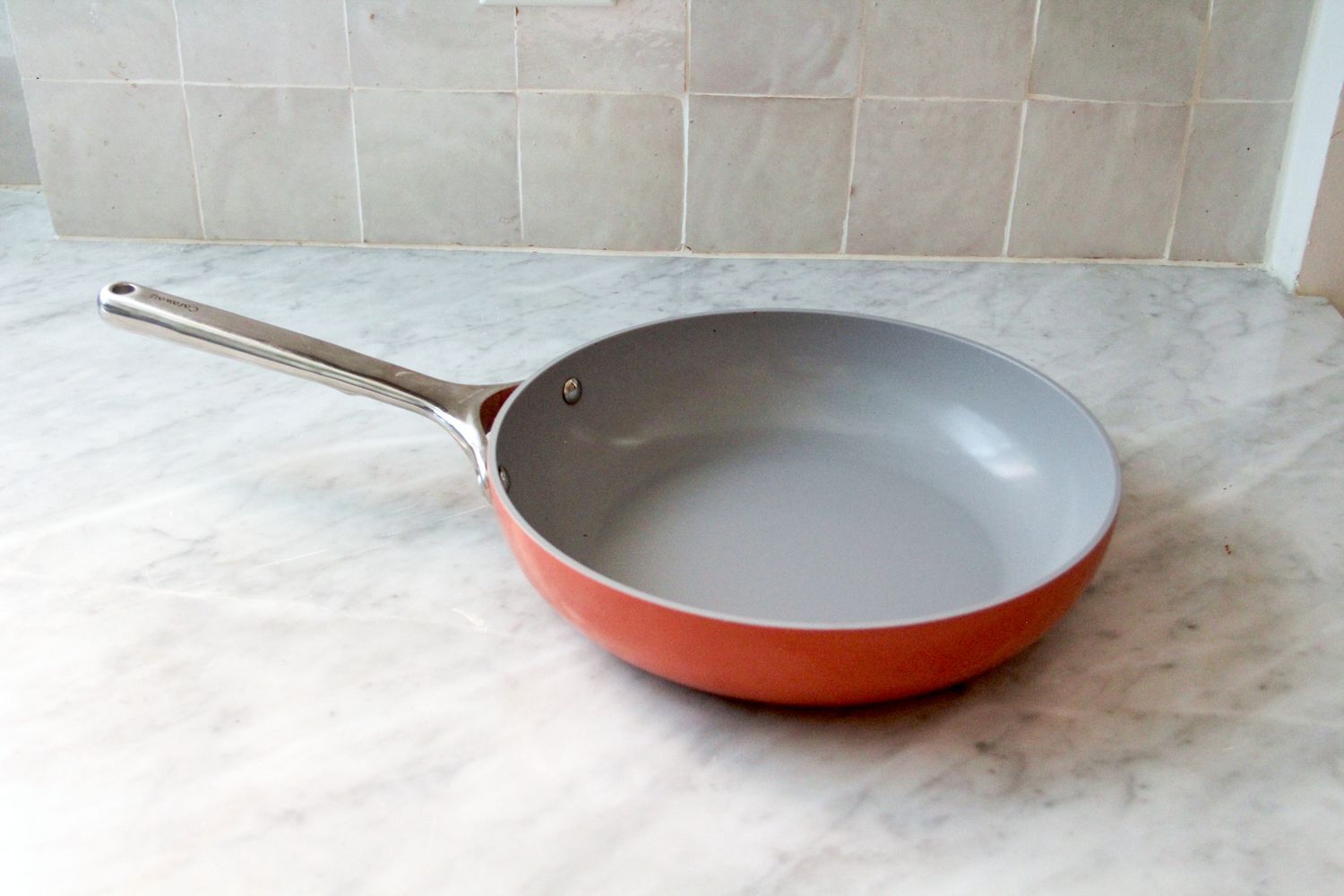 The Caraway Nonstick Ceramic Frying Pan on a kitchen counter