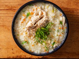 Overhead view of homemade dak juk, a comforting Korean rice porridge.