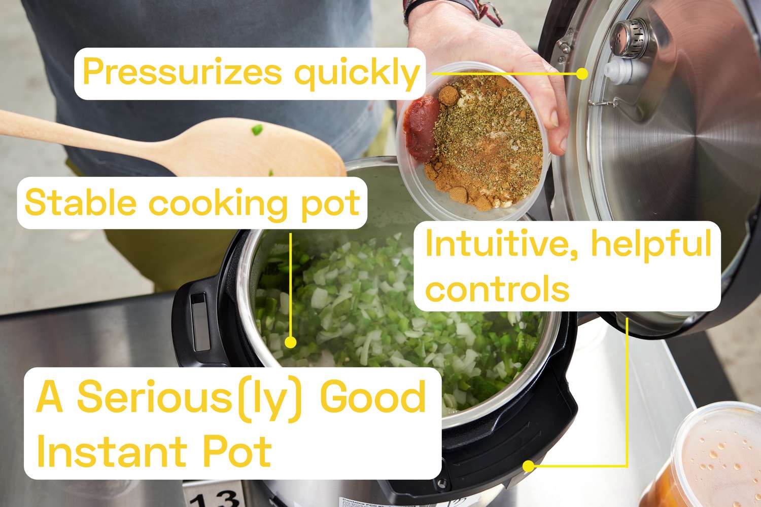 Vegetables being sautéed in an Instant pot. A person is adding spices to the vegetables.