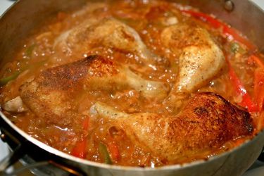 Skillet Braised Chicken with Peppers and Paprika in a large skillet, fresh from the oven.