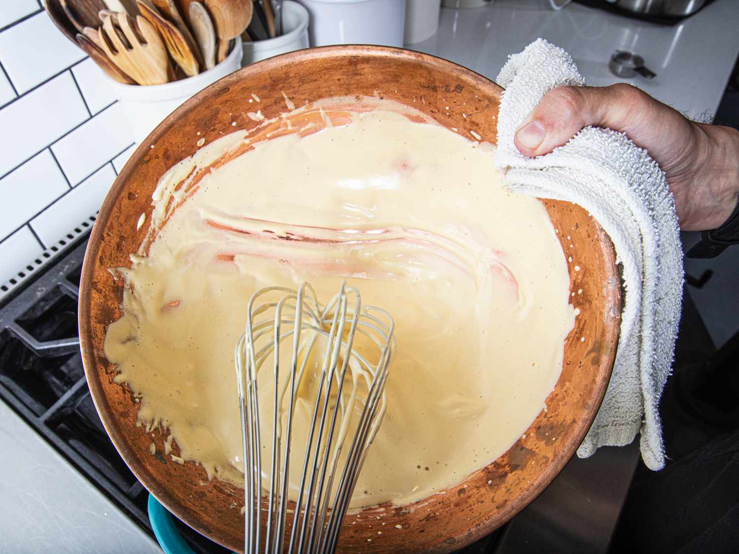 A view looking into the copper bowl of a fully whisked zabaglione.