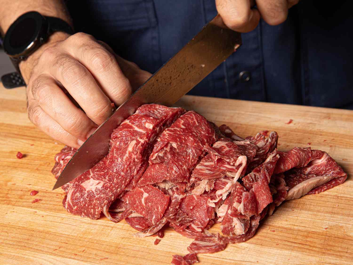 Philly cheesesteak ribeye raw meat cutting