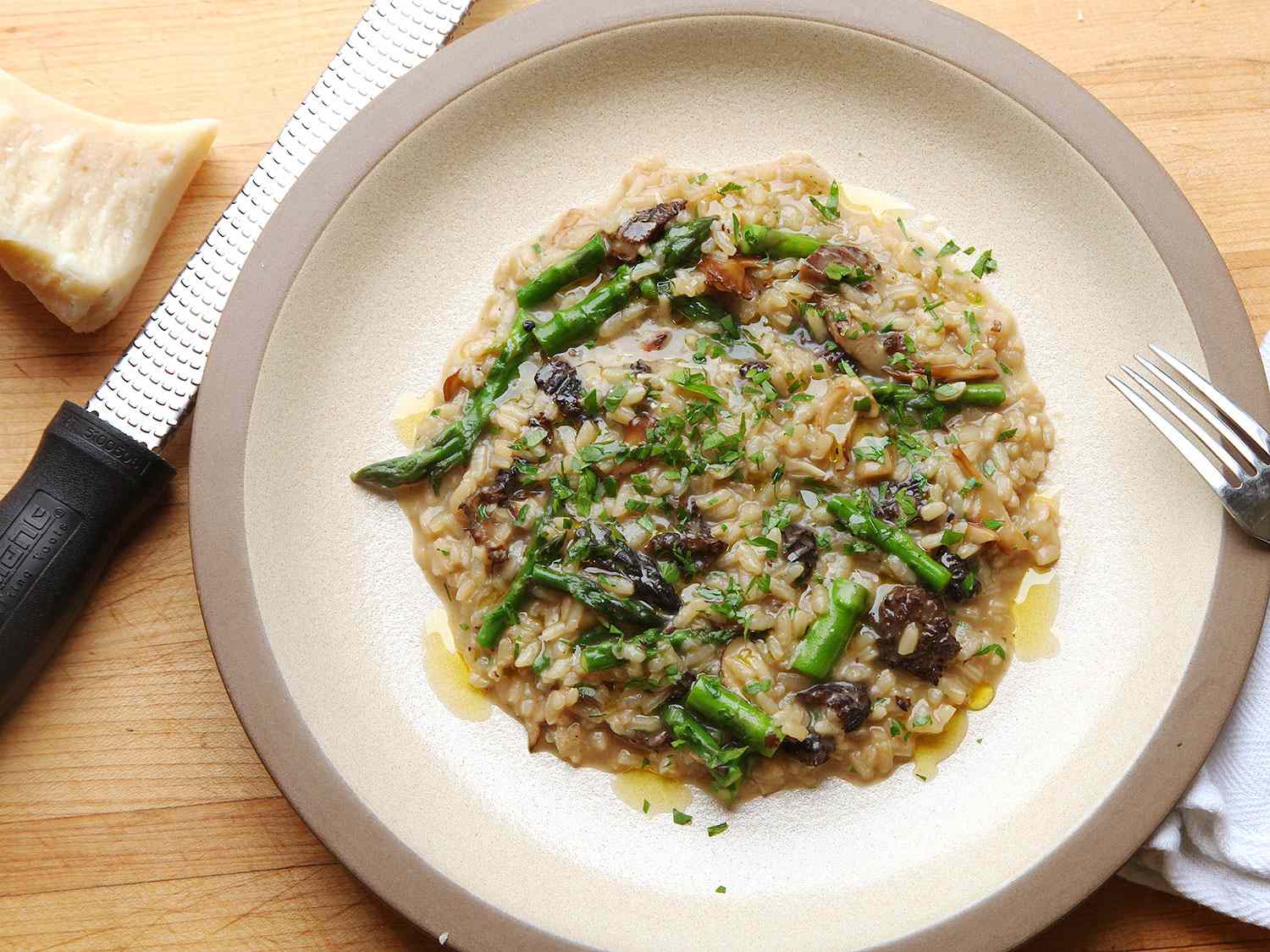 Overhead view of Mushroom and Asparagus Risotto, served on a plate.