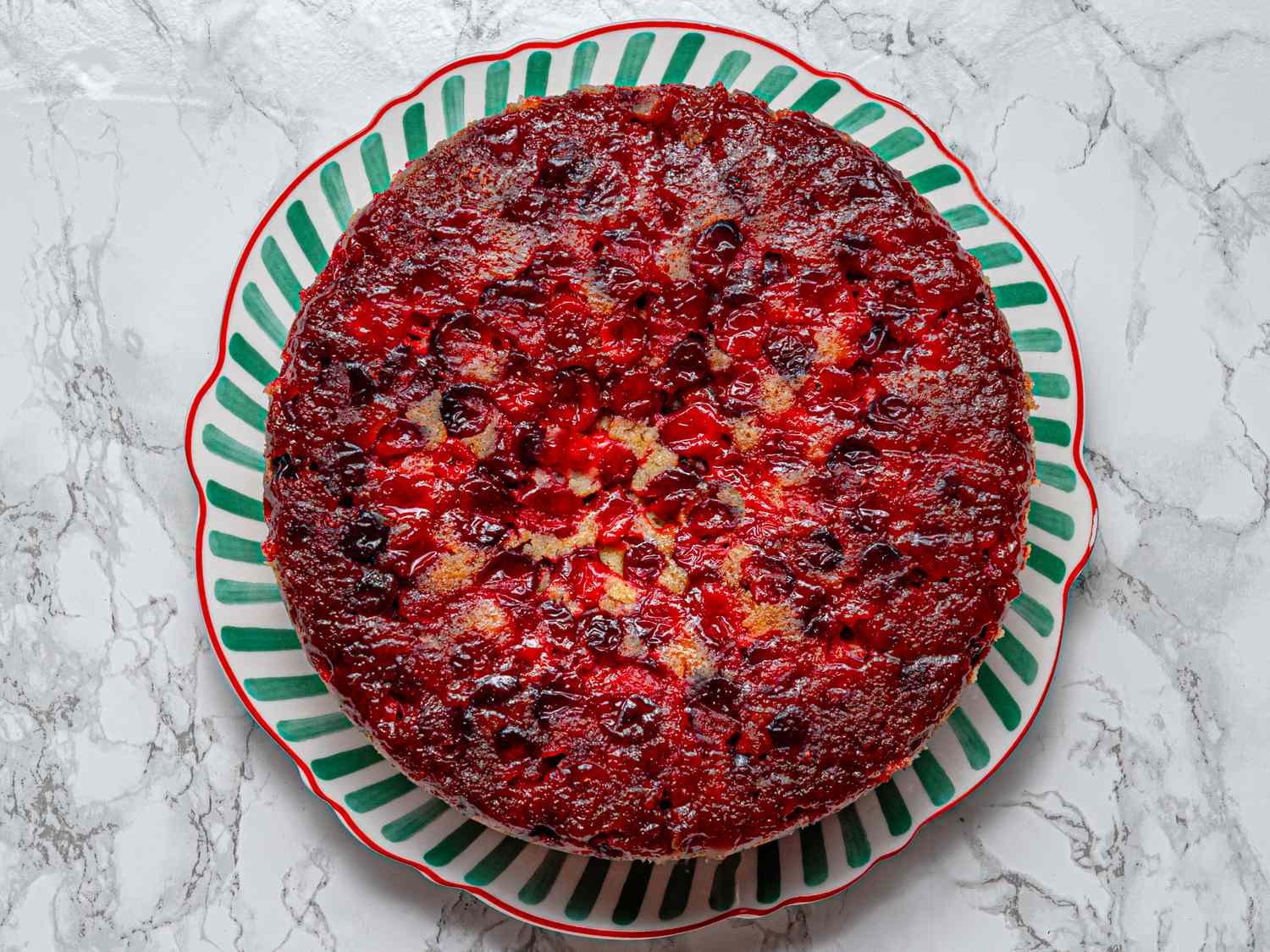 Cranberry upsidedown cake on a decorative plate