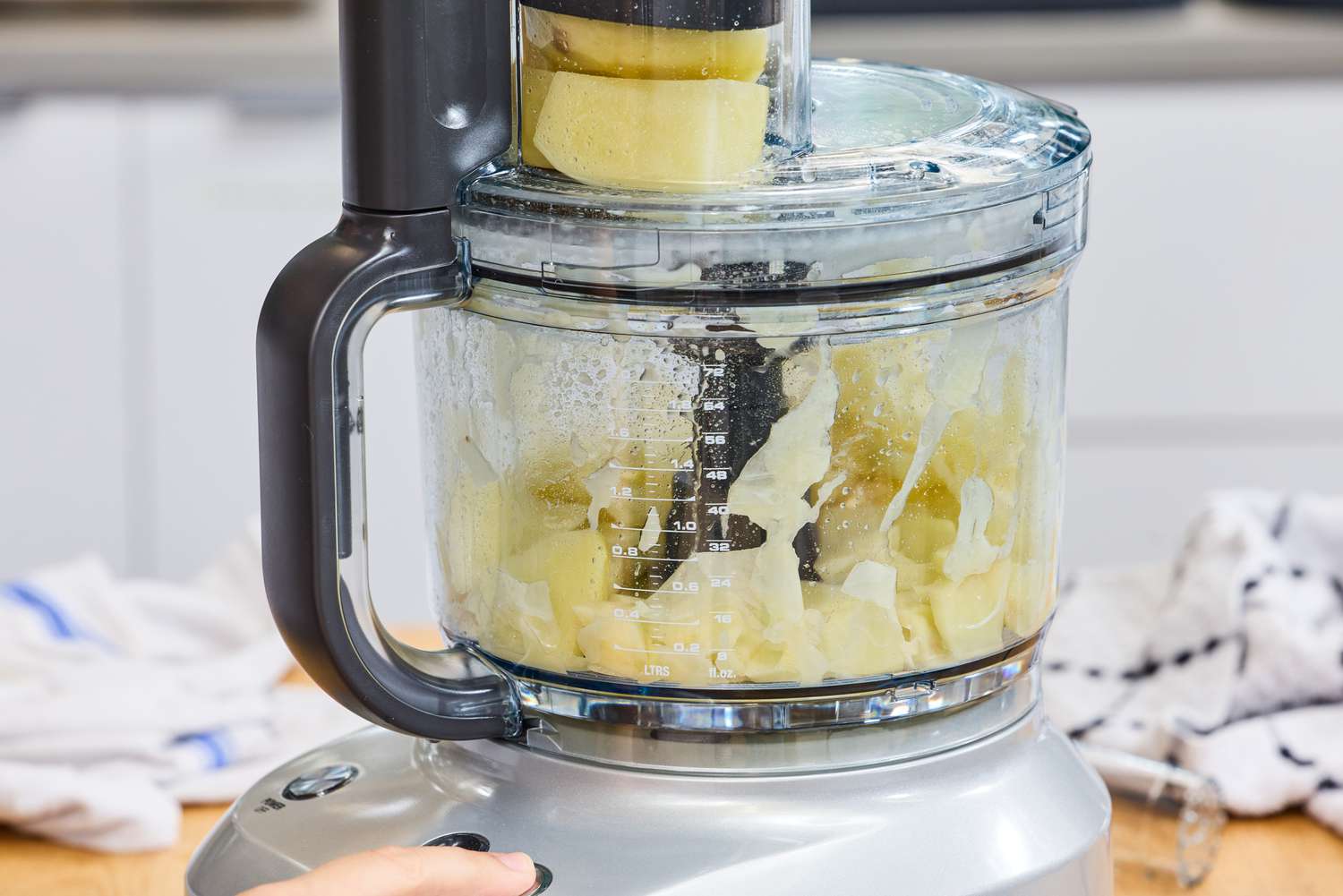 Food is chopped in the Breville BFP660SIL Sous Chef 12-Cup Food Processor