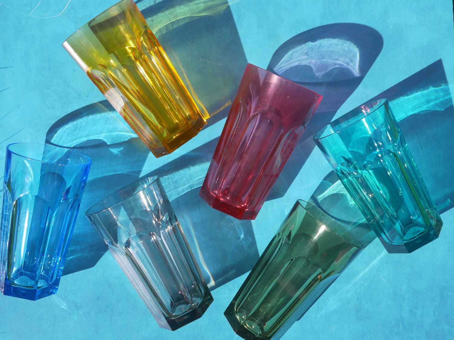 duraclear colorful tumblers on a blue surface