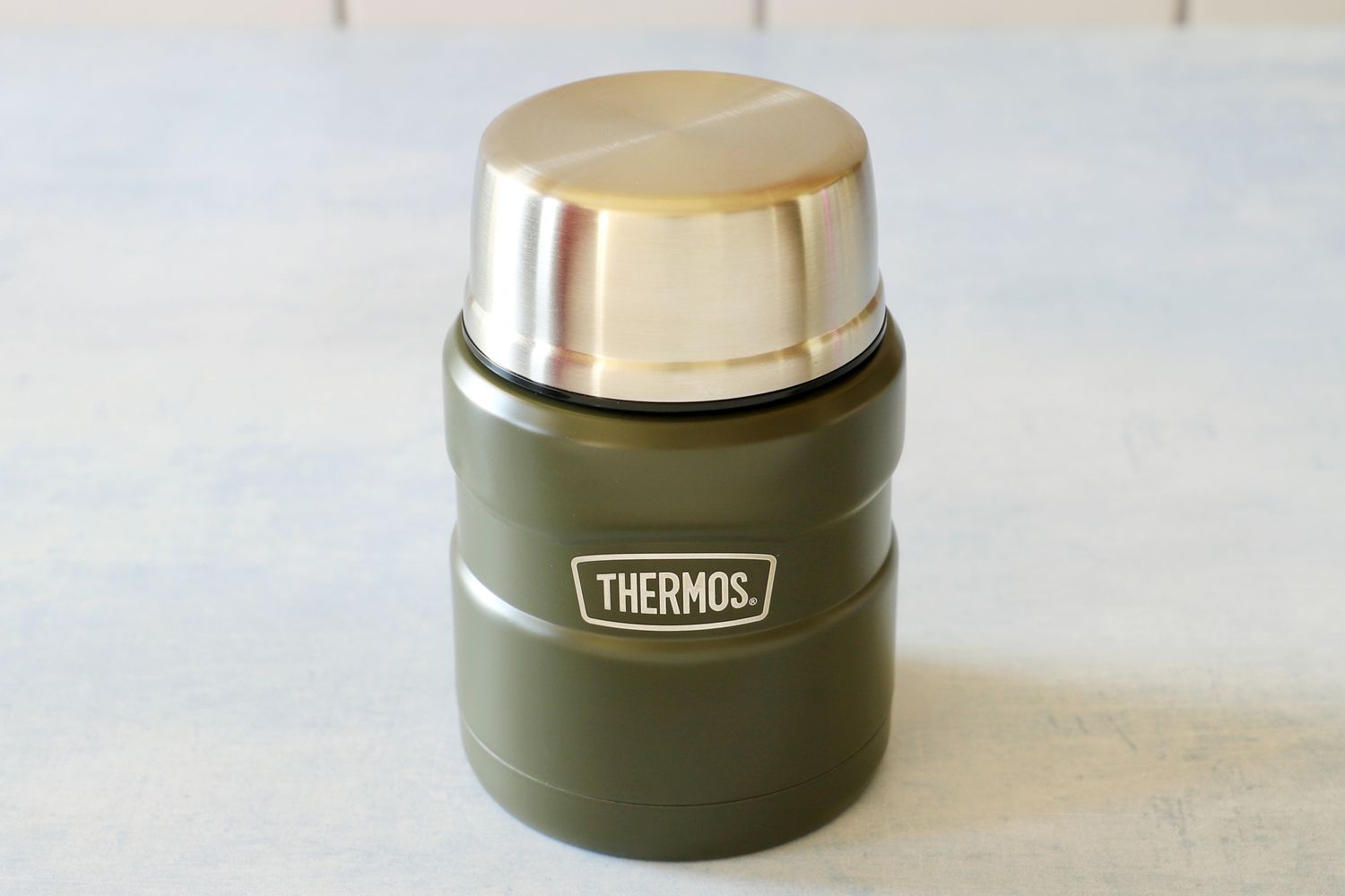 thermos food thermos on a blue background
