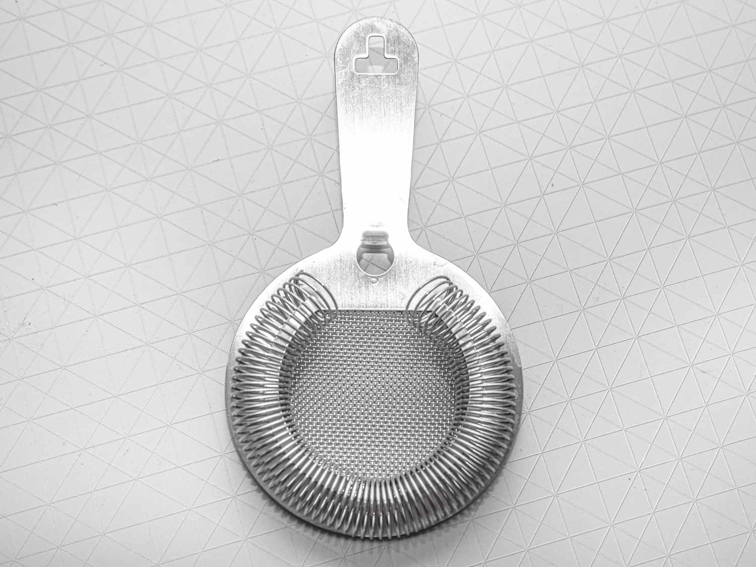 The Poor Man's Kitchen Kilpatrick Strainer on a grey surface
