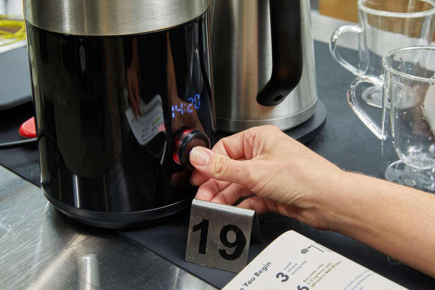 hand turning the dial on the OXO Brew 9-Cup Coffee Maker