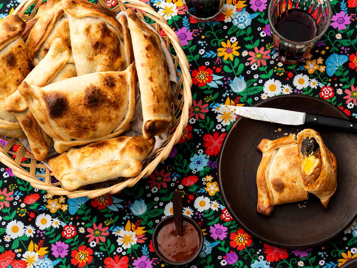 Overhead view of Empanadas de Pino on a traditional Chilean fabric