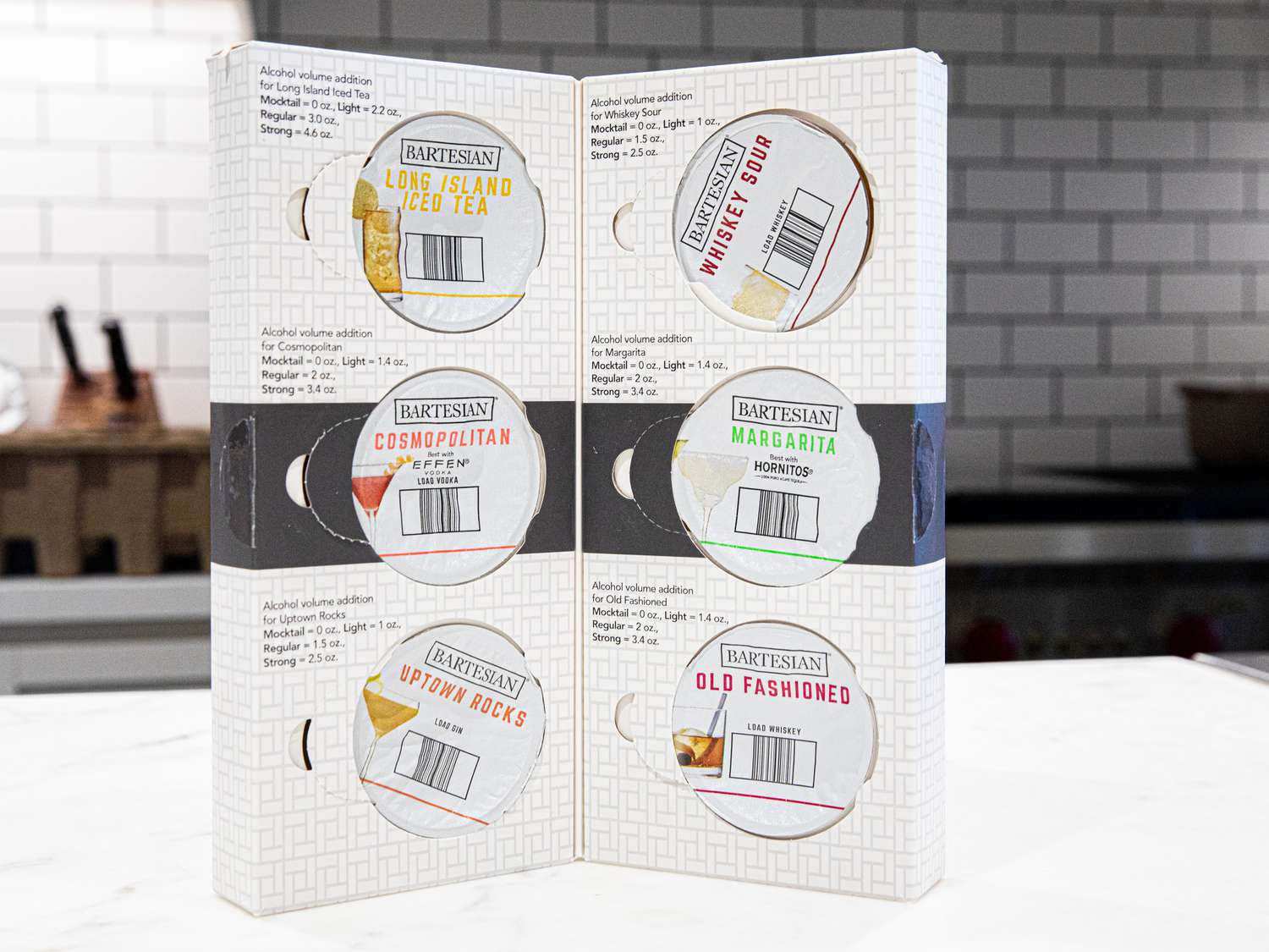 A package of Bartesian capsules standing upright on a countertop